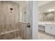 Modern tiled shower with a built-in bench in bathroom at 5152 Wildwind Dr, Apollo Beach, FL 33572