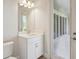Bathroom vanity with marble countertop and enclosed patio at 5152 Wildwind Dr, Apollo Beach, FL 33572