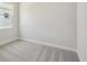 Bedroom features neutral carpet and an abundance of natural light at 5152 Wildwind Dr, Apollo Beach, FL 33572