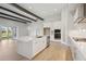 Bright, white kitchen features a spacious island and stainless steel appliances at 5152 Wildwind Dr, Apollo Beach, FL 33572