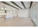 Open concept living room with kitchen in background and large sliding doors at 5152 Wildwind Dr, Apollo Beach, FL 33572