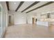 Open concept living room with kitchen in background and large sliding doors at 5152 Wildwind Dr, Apollo Beach, FL 33572