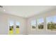 Bright living room featuring a view of the green backyard at 5152 Wildwind Dr, Apollo Beach, FL 33572