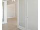 Bright living room entrance featuring wood-style floors at 5152 Wildwind Dr, Apollo Beach, FL 33572