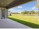 Patio with a view of the lake and green lawn at 5152 Wildwind Dr, Apollo Beach, FL 33572