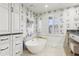 Stylish bathroom features a modern soaking tub, custom cabinetry, and designer fixtures at 5335 Sand Crane Ct, Wesley Chapel, FL 33543