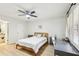 This bedroom features a ceiling fan, a comfortable bed, and a desk perfect for work or study at 5335 Sand Crane Ct, Wesley Chapel, FL 33543
