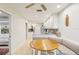Breakfast nook features a rounded table and a banquette. Adjacent is the kitchen at 5335 Sand Crane Ct, Wesley Chapel, FL 33543