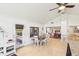 Charming dining room with long wooden table, white chairs, and plenty of natural light at 5335 Sand Crane Ct, Wesley Chapel, FL 33543
