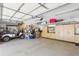 The garage features a golf cart, a bike rack, and built-in cabinets for storing tools and other items at 5335 Sand Crane Ct, Wesley Chapel, FL 33543