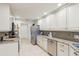Beautiful kitchen with stainless steel appliances, granite countertops, and ample cabinet space at 5335 Sand Crane Ct, Wesley Chapel, FL 33543