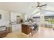 Open kitchen featuring a large island with seating, stainless steel appliances, and modern finishes at 5335 Sand Crane Ct, Wesley Chapel, FL 33543