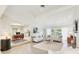 Spacious living room has tile floors and seamless access to other rooms at 5335 Sand Crane Ct, Wesley Chapel, FL 33543
