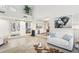 Open-concept living room with high ceilings and a modern design, offering a bright and airy atmosphere at 5335 Sand Crane Ct, Wesley Chapel, FL 33543