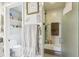 The shower room features a bench and is attached to the ensuite bathroom at 5335 Sand Crane Ct, Wesley Chapel, FL 33543
