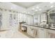 Ensuite bathroom features double sink vanity and large, bright window at 5335 Sand Crane Ct, Wesley Chapel, FL 33543