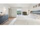 Bright main bedroom features wood floors, ceiling fan, and access to the outside at 5335 Sand Crane Ct, Wesley Chapel, FL 33543