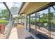Enclosed patio with brick flooring and outdoor seating area at 5335 Sand Crane Ct, Wesley Chapel, FL 33543