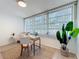 Bright bedroom featuring large window with vertical blinds and wood-look flooring at 5890 38Th N Ave # 305, St Petersburg, FL 33710