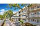 Well maintained condo building with mature trees, landscaping, and covered parking at 5890 38Th N Ave # 305, St Petersburg, FL 33710