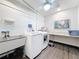 Bright laundry room with stainless steel washer and dryer, sink, and counter space; perfect for easy laundry days at 5890 38Th N Ave # 305, St Petersburg, FL 33710