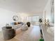 Bright living room with comfortable seating and sliding glass doors to the lanai at 5890 38Th N Ave # 305, St Petersburg, FL 33710