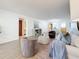 Open-concept living space with ample seating and a view of the dining area at 5890 38Th N Ave # 305, St Petersburg, FL 33710