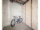 Indoor storage room with bike rack, wooden storage lockers, and cement walls provides extra storage at 5890 38Th N Ave # 305, St Petersburg, FL 33710