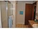 Bathroom with a glass door shower, granite vanity, and a clean, neutral color scheme at 601 W College Ave, Ruskin, FL 33570