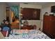 Comfortable bedroom featuring a view into the kitchen area, with wood style dresser at 601 W College Ave, Ruskin, FL 33570
