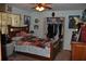 Bright bedroom featuring a ceiling fan, a cozy bed with decorative pillows and a well-organized closet at 601 W College Ave, Ruskin, FL 33570