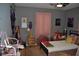 Relaxing bedroom with neutral walls, plush decor, and soft natural light at 601 W College Ave, Ruskin, FL 33570