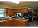 Cozy kitchen with wood cabinets, granite countertops, and a functional layout at 601 W College Ave, Ruskin, FL 33570
