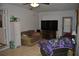 Cozy living room with a ceiling fan, tile floors, and easy access to the outside at 601 W College Ave, Ruskin, FL 33570