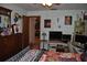 Main bedroom with a view into the next room and bright lighting fixture at 601 W College Ave, Ruskin, FL 33570