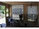Cozy sunroom featuring windows, plants, seating and natural light at 601 W College Ave, Ruskin, FL 33570