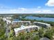 Panoramic aerial view of a waterfront condo community with lush landscaping and a swimming pool at 6205 Shoreline Dr # 1204, St Petersburg, FL 33708