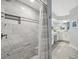 Spa-like bathroom with marble tiled shower and seating, open to the vanity area at 6205 Shoreline Dr # 1204, St Petersburg, FL 33708