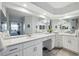 Large bathroom vanity with double sinks, white cabinetry, and luxurious marble countertops at 6205 Shoreline Dr # 1204, St Petersburg, FL 33708