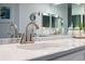 Close-up of the bathroom vanity featuring marble countertop, modern faucet, and decorative accessories at 6205 Shoreline Dr # 1204, St Petersburg, FL 33708