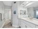 Bright bathroom with white vanity, marble countertops, large mirror, and modern fixtures at 6205 Shoreline Dr # 1204, St Petersburg, FL 33708