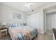 Bright bedroom featuring marine-themed decor, a comfortable bed and closet at 6205 Shoreline Dr # 1204, St Petersburg, FL 33708