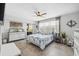 Bright bedroom featuring tile floors, coastal decor, and a comfortable bed with natural light at 6205 Shoreline Dr # 1204, St Petersburg, FL 33708