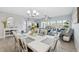 Open-concept space with living and dining areas, showcasing stylish furnishings and ample natural light, ideal for entertaining at 6205 Shoreline Dr # 1204, St Petersburg, FL 33708