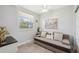Bright living room featuring tile floors, a cozy sofa and large window with a view at 6205 Shoreline Dr # 1204, St Petersburg, FL 33708