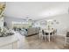 Spacious living room with dining area, comfortable seating, large windows, and stylish decor for a cohesive and inviting space at 6205 Shoreline Dr # 1204, St Petersburg, FL 33708