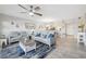 Comfortable living room with neutral colors, a ceiling fan, and a view into the kitchen and dining area at 6205 Shoreline Dr # 1204, St Petersburg, FL 33708