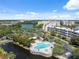 Community featuring a sparkling pool, jacuzzi, and lounging areas surrounded by mature palm trees, providing a relaxing retreat at 6205 Shoreline Dr # 1204, St Petersburg, FL 33708