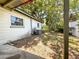 Exterior view of side of home and partially shaded backyard at 6350 55Th N Ave, St Petersburg, FL 33709
