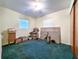 Bedroom with neutral walls, classic dresser, boxes and an assortment of tools laid out on the floor at 6350 55Th N Ave, St Petersburg, FL 33709